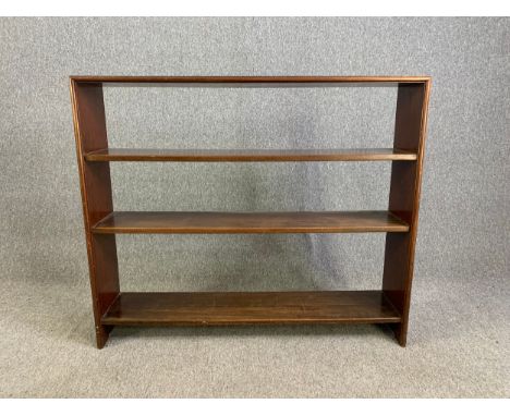 A vintage teak open bookcase. H.107 cm x W.127 cm x D.27 cm 