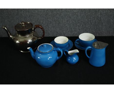 A vintage blue glazed porcelain part tea set and a silver glazed teapot. H.14cm. (largest). 