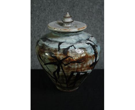 A studio glazed ceramic lidded ginger jar. H.26cm. 