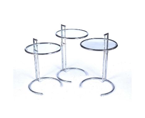 Eileen Gray (1878-1976)Set of three 'E1027' chrome and glass tables, height adjustable, 51cm across (3)Condition report: One 