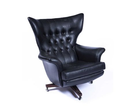 G plan Black swivel chair, mid 20th Century, unmarked, castors marked 'Made In England' alongside other indistinct writing, 9