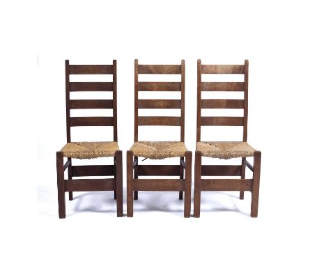 Heals three oak 'Letchworth' chairs, with raffia strung seats, 108cm high overall Condition report: Overall wear, marks and s