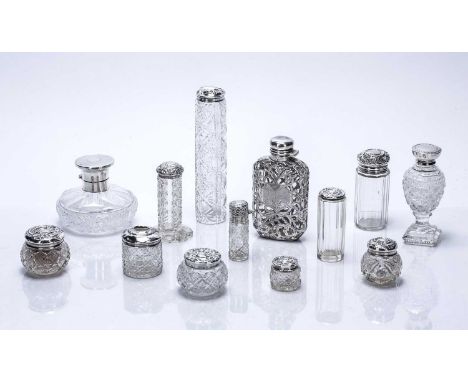 Collection of silver mounted and cut glass dressing table requisitesscent bottles and a silver filigree mounted hip flask or 