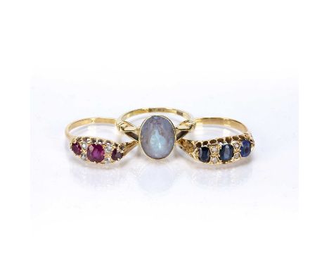 Three ringsthe first a unmarked (possibly 18ct gold) sapphire and diamond chip ring, size S, 5g approx overall, an 18ct gold,