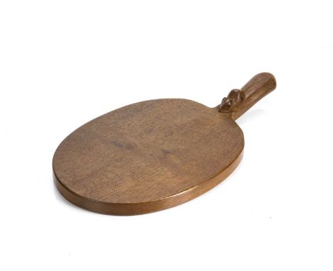 Robert Thompson of Kilburn (1876-1955)Mouseman cheese board, oak, carved mouse signature to handle, 39cm overallCondition rep