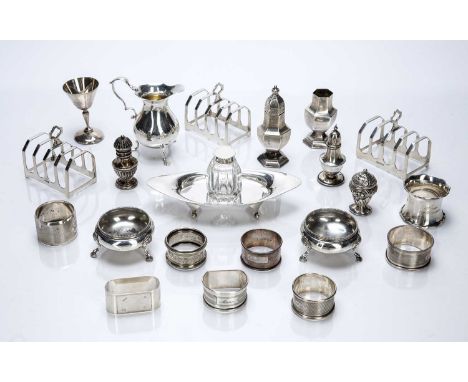 Collection of silver itemsconsisting of: a silver mounted glass inkwell on silver stand, 18cm across, a matched set of three 