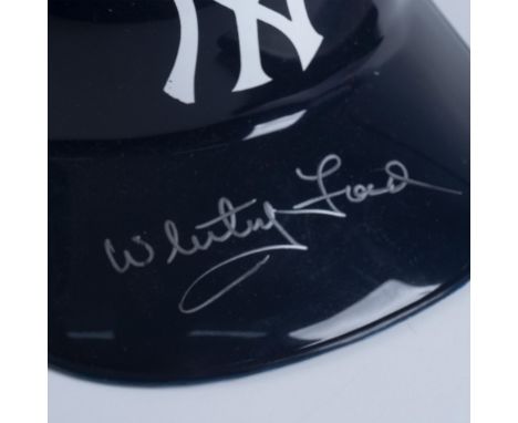 This pair includes a commemorative New York Yankees helmet signed on the brim in silver, along with an Ultra Pro baseball car