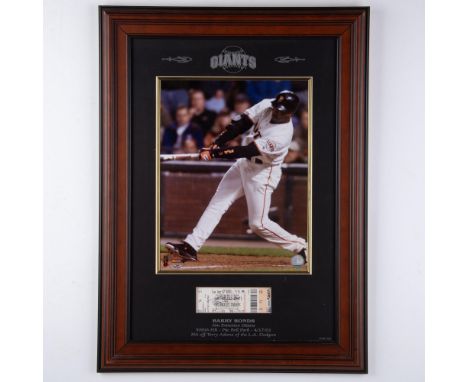 This stunning collectible features a photograph of Barry Bond's perfect swing, paired with a ticket from the game, signed by 