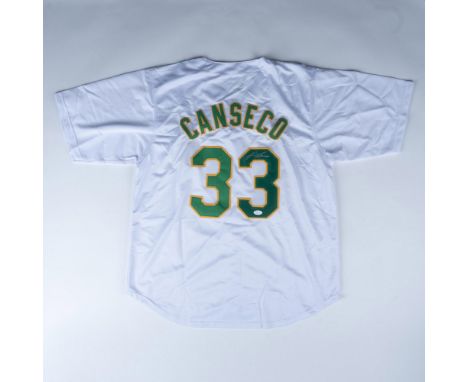 This white Oakland Athletics jersey has green lettering and is signed in silver ink by 6x All-Star Jose Canseco. It is tagged