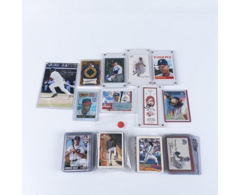 This baseball card collection features a mix of vintage and contemporary players, with many of the cards autographed. Notable