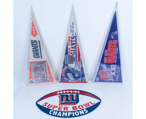 This grouping features a plastic football-shaped sign decorated with NY Super Bowl Champions. It also includes three pennants