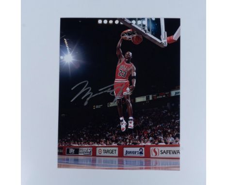 Incredible photo of basketball GOAT Michael Jordan signed in silver permanent ink. Certificate of Authenticity included from 