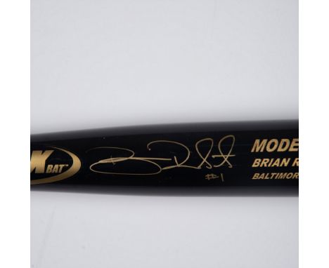 This black and dark wood-colored Model BR1 bat, a Brian Roberts model from the Baltimore Orioles, is signed in gold by Brian 