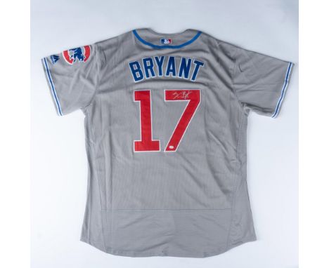 This grey Cubs jersey with blue lettering and red number 17 is signed by Kris Bryant. Measures 25"W pit to pit, 32"L. Certifi