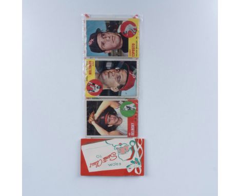 A set of baseball cards sealed in plastic, topped with a Christmas card that says From Santa Claus, featuring players such as