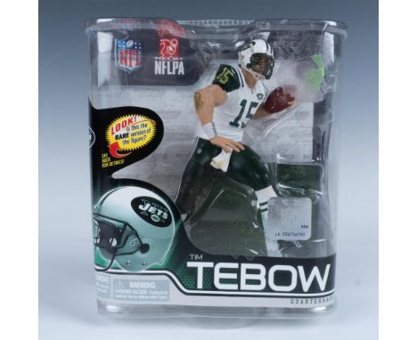 Unopened Tim Tebow figure dressed in the NY Jets white and green uniform #15. Tebow is posed running with the ball. This item