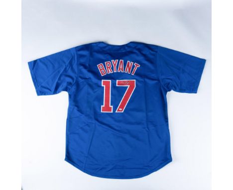 A deep blue Chicago Cubs jersey, autographed by Kris Bryant, featuring his name and number on the back. Kris Bryant signature