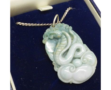 A jade snake pendant and a silver chain