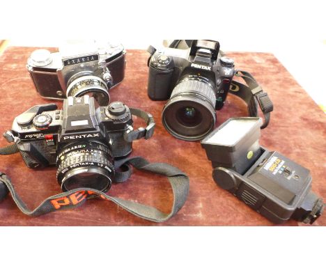 Three cameras, Exakta, Pentax Program A and a Pentax IST D camera and a Miranda 500-CD flash