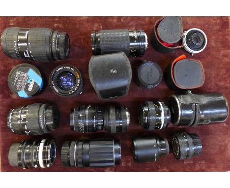 Fourteen camera lenses and adaptors, including Sigma and Carl Zeiss Jena DDR