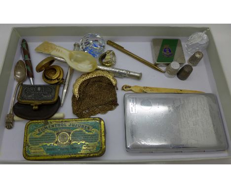 A letter opener, a bone needle holder, caddy spoon, a white metal pencil, a silver Charles Horner thimble, a gilt purse, a so