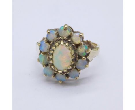 A 9ct gold and opal ring, 3.2g, N