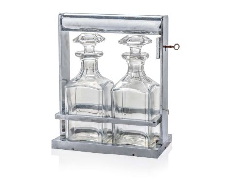  JACQUES ADNET (1900-1984) TANTALUS, CIRCA 1935 chromium-plated metal frame, mirrored base, glass carafes, original key 20cm 