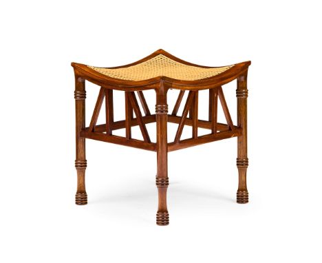  MANNER OF LIBERTY & CO. THEBES STOOL, CIRCA 1920 mahogany, with caned seat 38.5cm square, 43.5cm high   