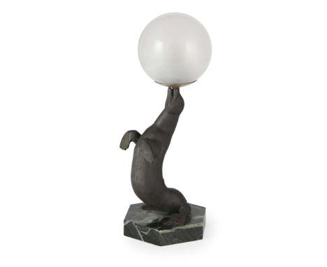  AFTER LOUIS-ALBERT CARVIN ART DECO SEAL LAMP, CIRCA 1930 patinated metal, glass on a marble base 31cm high   