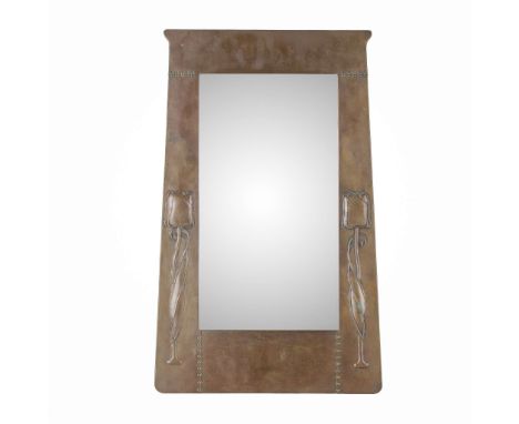  LIBERTY & CO. WALL MIRROR, CIRCA 1910 repoussé-decorated copper, mirror plate, ivorine maker's label&nbsp; 63cm x 39.5cm&nbs