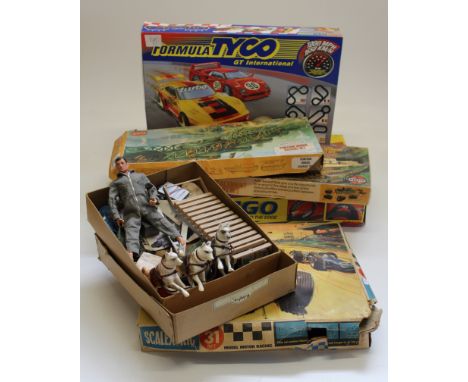 A mixed lot to include Action man items and animals, two Airfix Army sets, two Scalextric sets and two others boxed