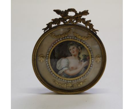 20th century European School, half length portrait miniature of a bacchanalian nymph. 5.5cm diameter, in ornate paste set gil