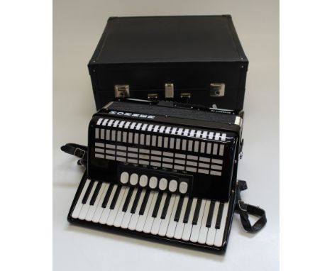 A cased Hohner Student 72 Piano Accordion