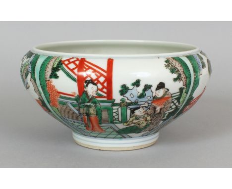 A CHINESE FAMILLE VERTE PORCELAIN BOWL, decorated with figural terrace and garden panel scenes, the base with a six-character