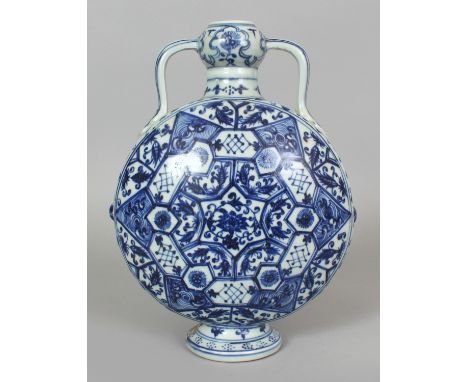 A CHINESE YUAN STYLE BLUE & WHITE PORCELAIN MOON FLASK, decorated with a variety of formal floral panels, the base with an un