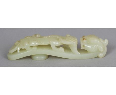 A CHINESE CELADON JADE BELT HOOK, of traditional form, 4.1in long.