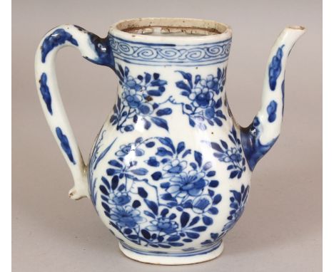 A CHINESE KANGXI PERIOD BLUE & WHITE PORCELAIN EWER, painted in a good tone of underglaze-blue with floral sprays, 5.3in long