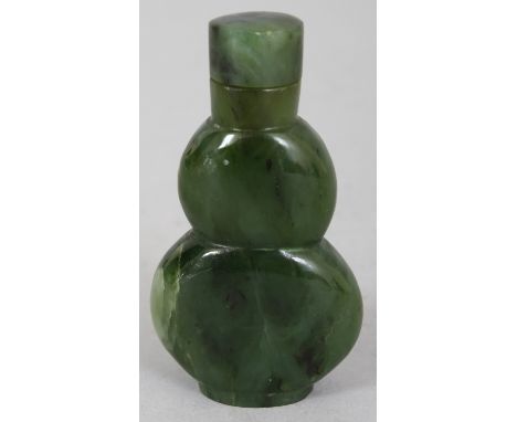 A CHINESE SPINACH GREEN JADE DOUBLE GOURD SNUFF BOTTLE & STOPPER, 2.4in high.