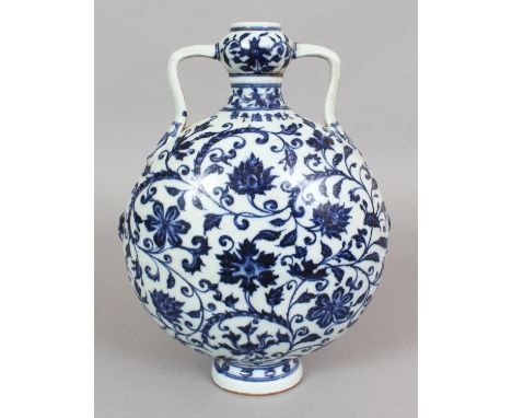 A CHINESE MING STYLE BLUE & WHITE PORCELAIN MOON FLASK, decorated with a design of formal scroll-stemmed flowerheads, the sho