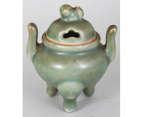 A SMALL ORIENTAL CELADON PORCELAIN TRIPOD CENSER & COVER, 3.5in wide including handles & 4.2in high.
