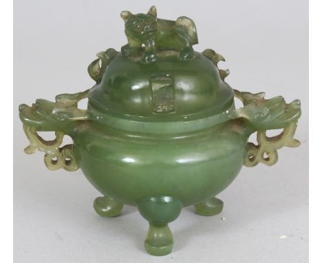 AN EARLY 20TH CENTURY CHINESE GREEN JADE TRIPOD CENSER & COVER, with pierced dragon handles 4.75in wide including handles & 3