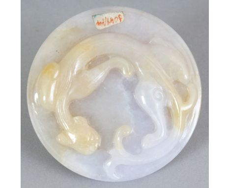 A CHINESE WHITE JADE DISC, carved to one side with a chilong and to the reverse side with a phoenix, 2in diameter.