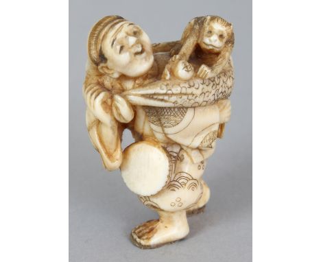 A SMALLER SIGNED JAPANESE MEIJI PERIOD IVORY NETSUKE OF A MONKEY PERFORMER, the walking man holding a drum in one hand and wi