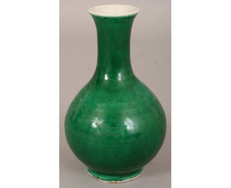 A SMALL 19TH CENTURY CHINESE APPLE GREEN MONOCHROME PORCELAIN VASE, the base with a four-character Kangxi mark, 4.75in high.