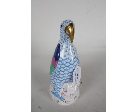 Herend porcelain figure depicting a parrot with blue scale decoration to the body, incised 5006 to base, 21cm high