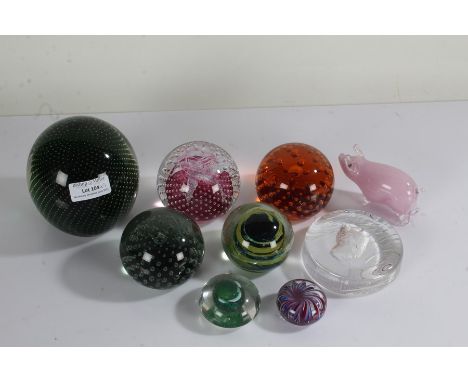 Nine various glass paperweights, to include a Langham pig and Caithness Cauldron (9)