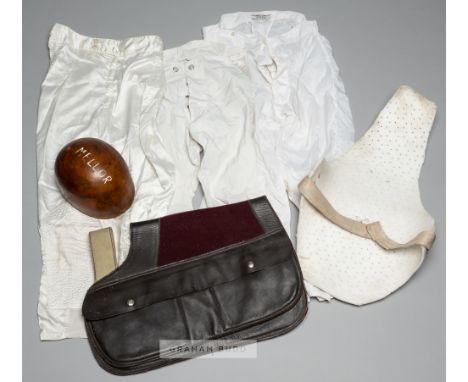 Race riding equipment belonging to the jockey Stan Mellor MBE,comprising cork shell skull cap with internal webbing and maker