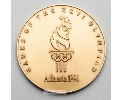 Atlanta 1996 Olympic Games participant's medal,designed by M. Grear, bronze, obverse with official torch logo with Olympic ri