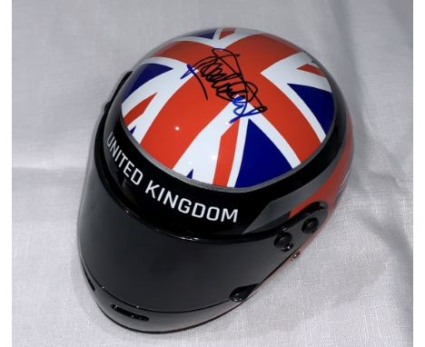 Sir Jackie Stewart signed Silverstone F1 replica helmet (1:2 scale), signed on top of the helmet on UK flag, with COA and exa