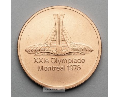 Montreal 1976 Olympic Games participant's medal,designed by G. Huel and P. Pelletier, copper, obverse depicting Olympic Stadi